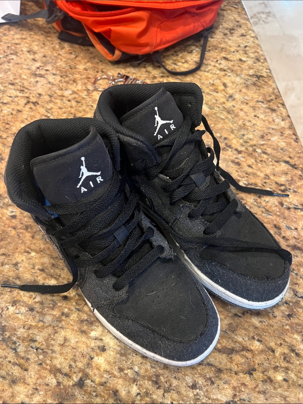 Jordan youth Black and White High-Top Sneakers 7Y